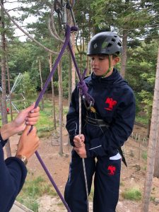Boy in harness getting ready to abseil