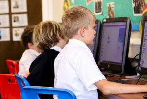 A boy in Year 3, on the Computer during a Compute Science lesson. 