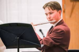 Sixth Form boy playing flute