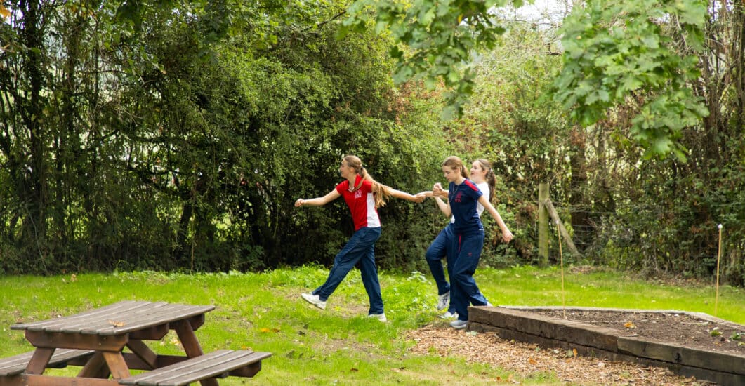 A photograph of pupils from Hurstpierpoint College engaging in a Belonging activity.