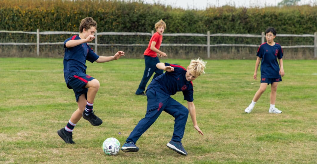 A photograph of pupils from Hurstpierpoint College engaging in a Belonging activity.